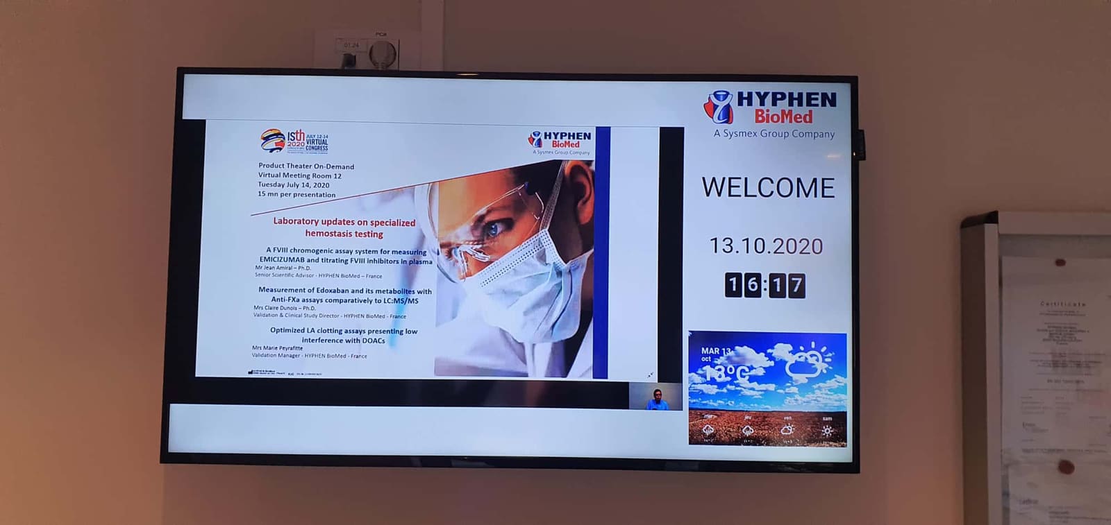 Hyphen BioMed, France: the reception screen with a welcome, the date and the weather