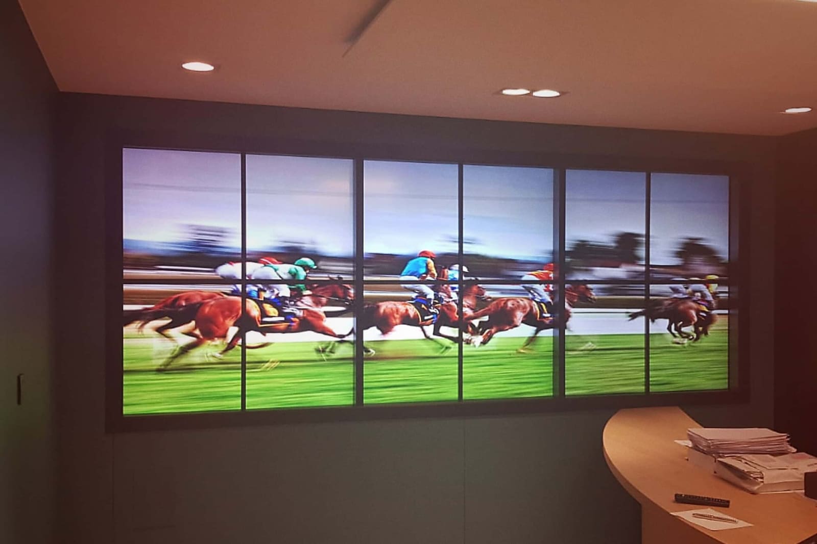 A notary's waiting room with an easyCMS display