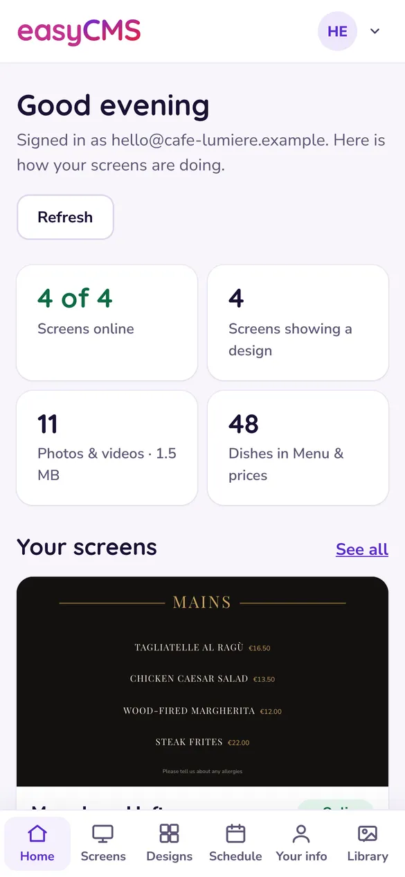 Studio's Home page on a phone: four of four screens online, designs showing, photos and dishes counted.
